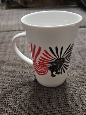 Oscardo Peaza Porcelain Mug By Kenojnak Ashevak